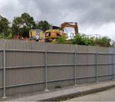 A construction vehicle behind a fence

Description automatically generated with low confidence